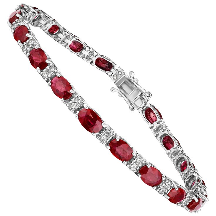 • A beautiful row of red oval cut rubies and white round brilliant cut diamonds encircle the wrist in this bracelet, set in 14KT gold. The bracelet measures 7" in length and has a combining total weight of approximately 11.50 carats. Each stone has been carefully matched and set by Hand in New York City. • Number of Oval Cut Rubies: 20 • Carat Weight: 11.50ctw • Rubies measure: 6x4mm • Number of Round Diamonds: 40 • Carat Weight: 1.00ctw • 7" Long • 14KT Gold • Available in White, Yellow, or Rose Gold Round Diamond Bracelet, Bracelet Tennis, Red Jewel, Gold Armband, Tennis Bracelet, Round Brilliant Cut Diamond, 14kt Gold, Brilliant Cut Diamond, Oval Cut