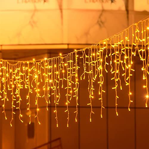 a string of lights hanging from the side of a building