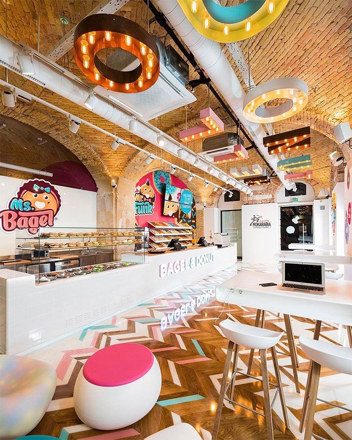 the interior of a fast food restaurant with brightly colored lights