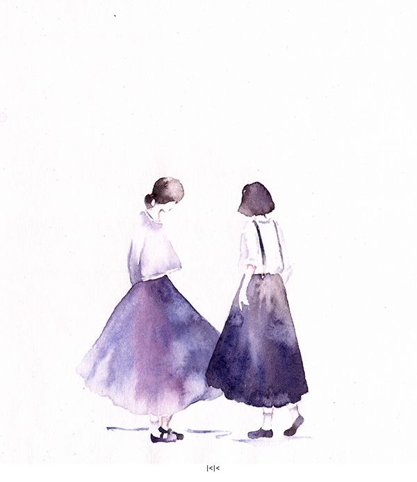 two women are walking down the street in long skirts and white tops, one is wearing a blue dress