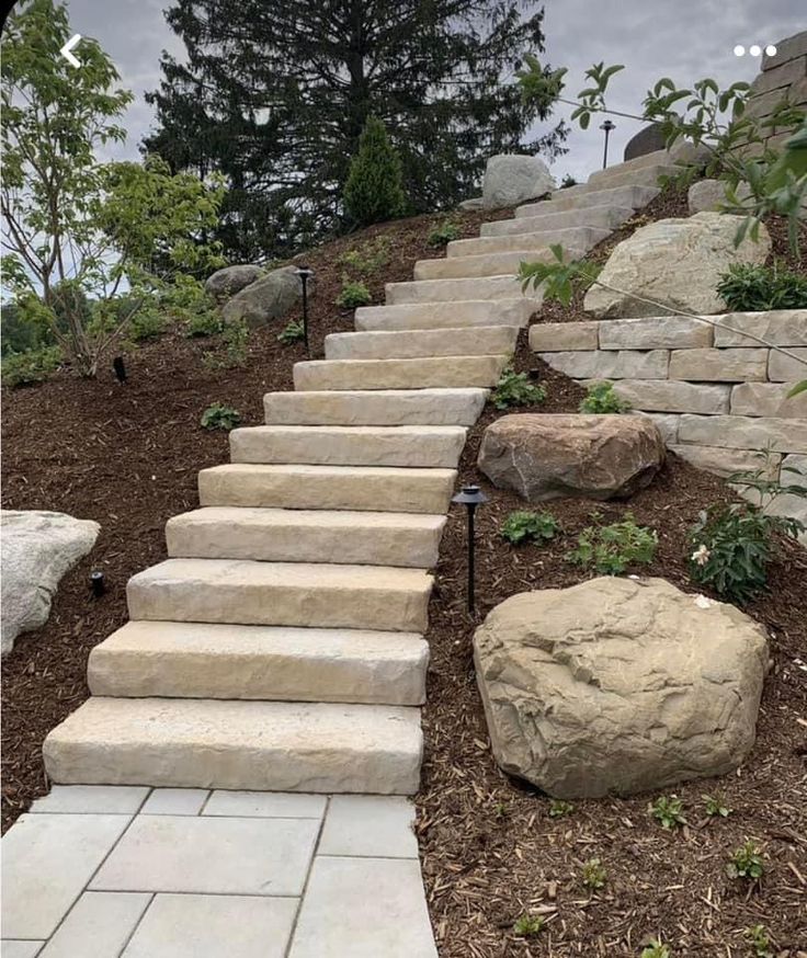 stone steps leading up to the top of a hill