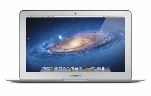 an open macbook air laptop computer on a white background with space in the background