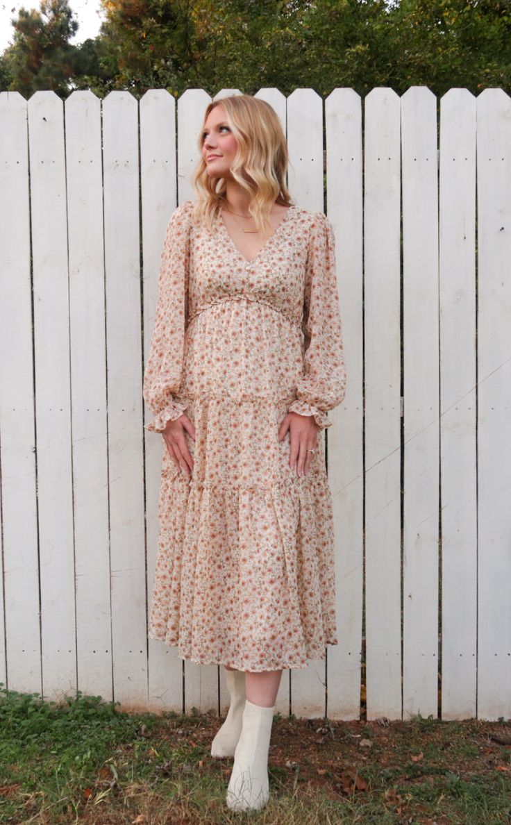 Stop, drop, and SLAY all day in this dress! Our Floral Surplice Maxi Dress in Ivory is a gorgeous maxi dress that includes long sleeves with elasticized cuffs, v-neckline with 2 faux buttons and ruffle, and it is lined. ABOUT THIS ITEM: Made in Vietnam. Fabric is 100% Polyester. Hand Wash in Cold Water Inside Out. Hang or Line Dry. The Model is 5'7 and wearing a small. Gorgeous Maxi Dresses, Slay All Day, Cold Water, Vietnam, Inside Out, Happy Shopping, Hand Wash, Long Sleeves, Maxi Dress