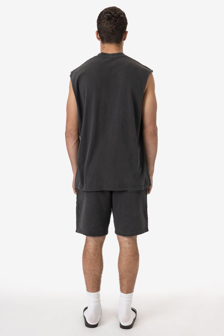 A sleeveless, cutoff version of our bestselling 1801GD Garment Dye T-shirt. This unisex muscle tank features a crew neckline with deep, raw-hemmed sleeves. Made of 100% USA cotton, this textile is beefy, durable, and absorbent, and is virtually shrink free as a result of garment dyeing. The garment is washed with natural enzymes, resulting in a broken-in feel, just like a T-shirt that was washed or worn for a decade or two. Made in Los Angeles, Calif. Our experienced sewers earn up to $25 an hou Lace Knitwear, Kids Garments, Denim Workwear, Sweater Jumpsuit, Denim Sweater, Jumpsuit Jacket, Sleeveless Tee, Leather Denim, Sleeveless Vest