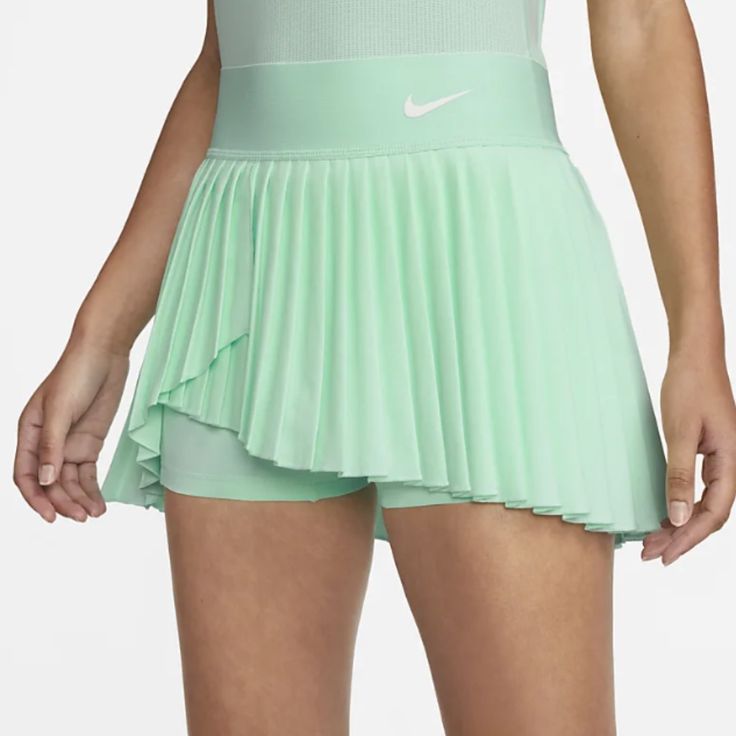 Make A Statement On The Court In This Flowy Skirt. The Lightweight, Stretchy Design Is Crafted Using Layers Of Pleats That Spin And Flare While You Run The Court, While Built-In Shorts Make Sure You Stay Covered. Play At Your Best No Matter What The Game Throws Your Way. -Nike Dri-Fit Technology Moves Sweat Away From Your Skin For Quicker Evaporation, Helping You Stay Dry And Comfortable. -Inner Shorts Let You Tuck Spare Balls Under The Hem For Convenient Storage. -Body: 100% Polyester. Shorts: Workout Skort, Nike Skort, Blue Tennis Skirt, Nike Tennis Skirt, Athletic Skort, Athletic Skirt, Pleated Tennis Skirt, Tennis Skort, Flowy Skirt