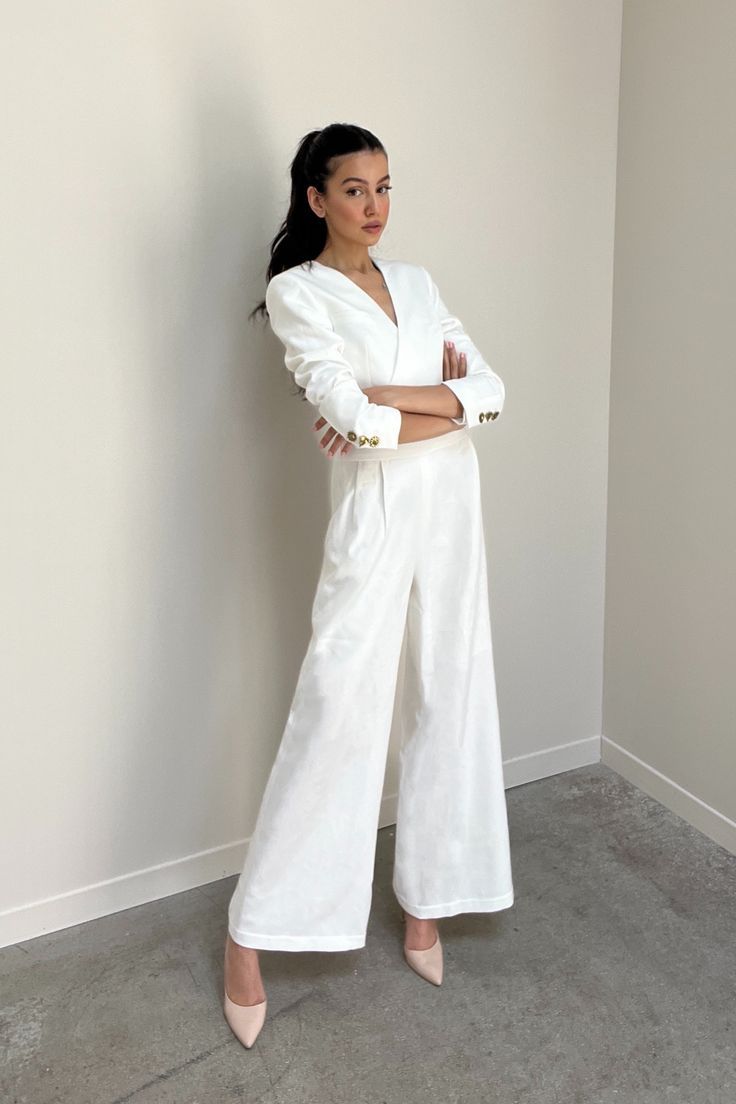 This is an elegant choice but still exudes elegance and charm for the wearer. This item is suitable for many different activities. #WearMean Chic White V-neck Sets, White V-neck Jumpsuits And Rompers For Formal Occasions, Elegant Long Sleeve Summer Pantsuit, Elegant Summer Long Sleeve Pantsuit, Summer Elegant Long Sleeve Pantsuit, Elegant Summer Pantsuit With Long Sleeves, Elegant White V-neck Set, Summer Formal V-neck Sets, Elegant V-neck Office Set