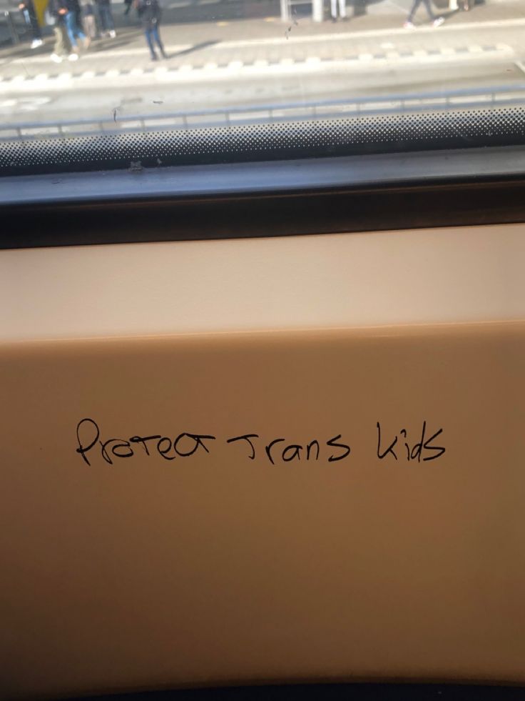 writing on the side of a train window that says detroit tam's wiks