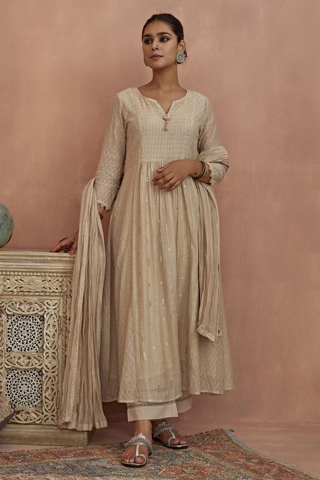 Ivory chanderi A-line anarkali with thread and sequins embroidery. Comes with cotton pant, a dupatta and a slip.
Components: 4
Pattern: Embroidered
Type Of Work: Thread, Sequins
Neckline: Notched
Sleeve Type: Three quarter
Fabric: Chanderi, Pant: Cotton
Color: Ivory
Other Details: 
Length:
Kurta: 50 inches
Pant: 38 inches
Occasion: Mehendi and Haldi - Aza Fashions Lace Anarkali, Chikankari Anarkali, Anarkali Churidar, Blue Anarkali, Pink Anarkali, Silk Anarkali, Sequins Embroidery, Red Silk, Pants Pattern