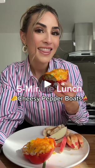 a woman holding up a piece of food in front of her face