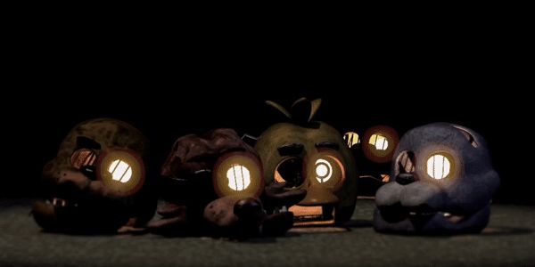 three small toy animals with glowing eyes in the dark