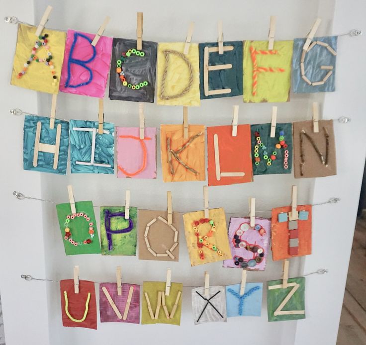 the letters are hung on clothes pegs to spell out their name