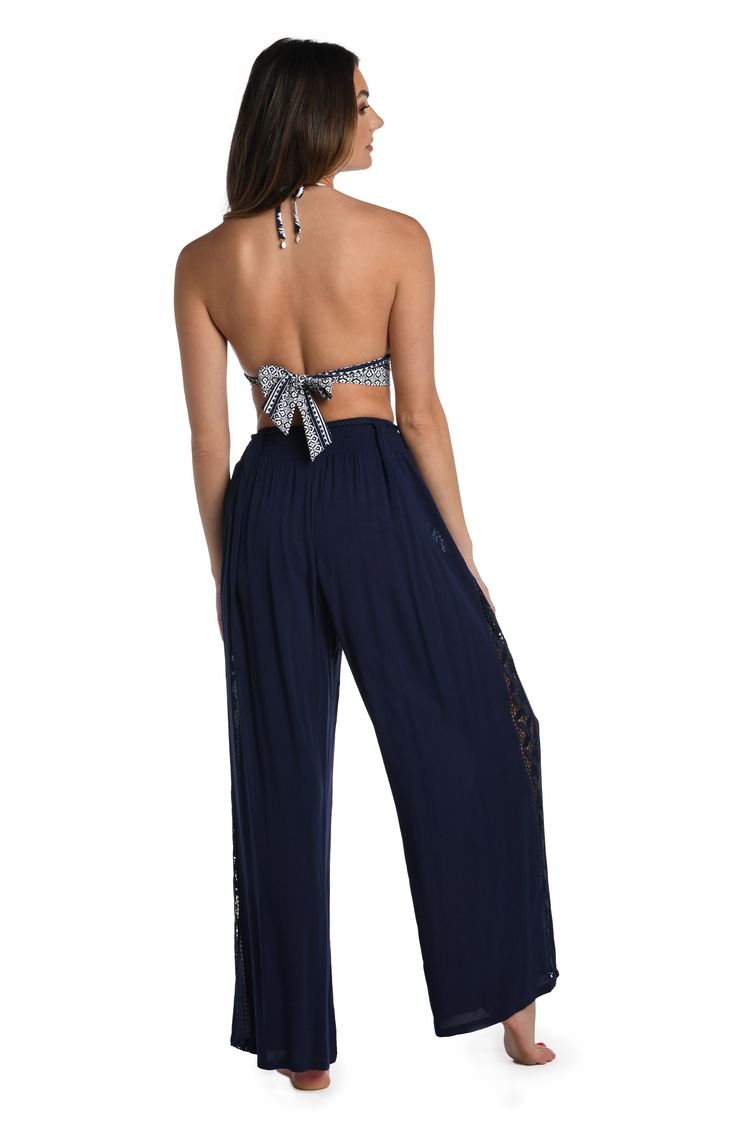 These palazzo pants get their boho-inspired style from crocheted side panels. Perfect for pulling on post dip, you can wear them as a swimsuit cover-up but they also look fabulous with a tank or cami for an effortlessly chic look. A gently elasticized waist offers a comfortable fit. [split] Details Palazzo-style beach pants Elasticized waistband Wide legs for a flowy fit Lightweight rayon fabric Fabric 100% Rayon Pallazo Pant, Black Palazzo Pants, Palazzo Style, Palazzo Pant, Beach Pants, Rayon Fabric, Wide Legs, Swimsuit Cover, Side Panels