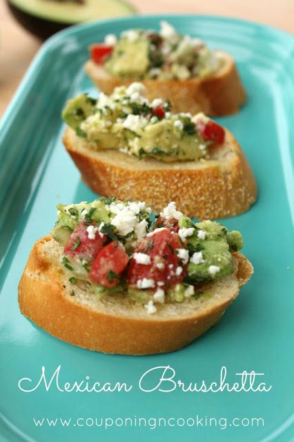 three pieces of bread with avocado and tomatoes on them sitting on a blue plate