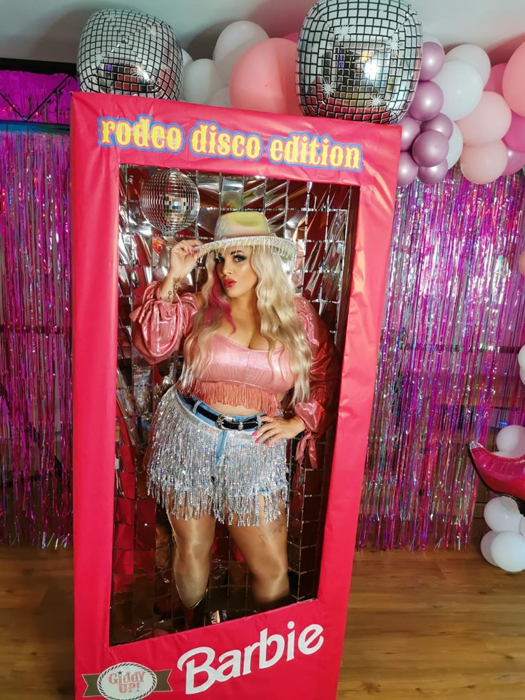 a barbie disco - themed party with balloons and decorations