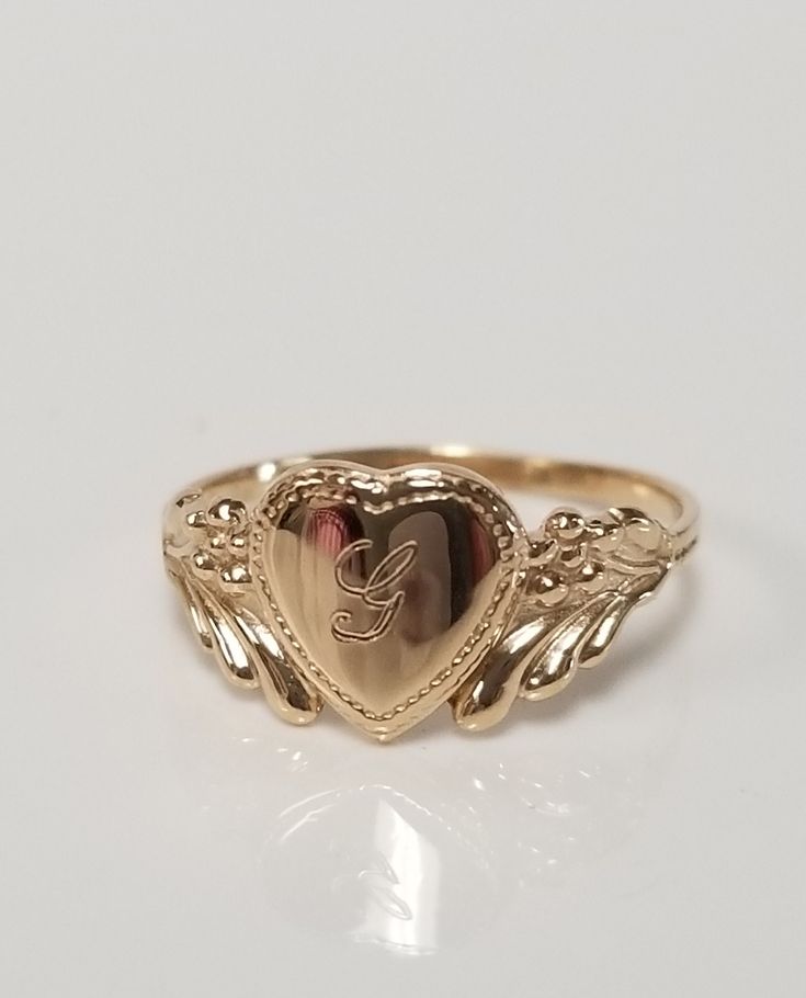 "Thanks for shopping our vintage estate store. We tend to sell well below wholesale and truly hope you enjoy all of our items. Many of the items are one of a kind, so please enjoy scrolling through the pictures and hopefully something will catch your eye. Brown spots are from camera or reflections. Estate 10k yellow gold monogram capital G cursive heart ring. Custom made ring for our shop. Ring size: 3 Setting: 7.5mm 1/4\" to 3/8\" Band width: 1.4mm Weight: .90 gram Marked 10k and it's sweet. On G Cursive, Cursive G, Freetime Activities, G Initial, G Ring, Antique Style Rings, Custom Wedding Band, Dope Jewelry, Gold Monogram