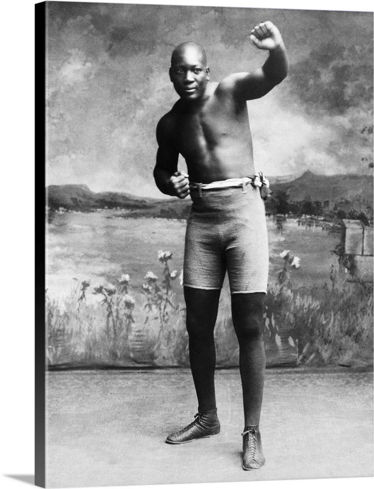 an old black and white photo of a man flexing his muscles