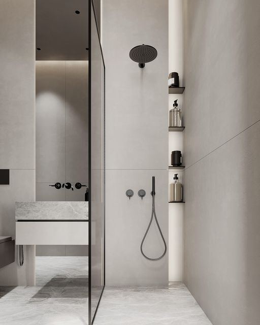 a bathroom with a shower head, sink and shelves on the wall next to it