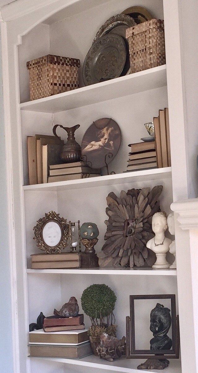 an open bookcase with many items on it