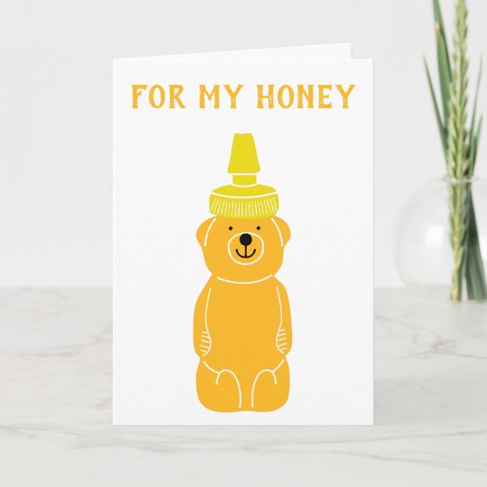 a card with an image of a bear wearing a hat