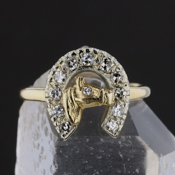 Description:Channel your love for horses and elegance with this unique vintage horse shoe ring. Crafted from 14K yellow gold, this 4.68-gram ring showcases a stunning horse head design encircled by a horseshoe adorned with 12 round-cut diamonds. These J-colored diamonds total 0.48 carats with I1 clarity, adding sparkle and character to this equestrian-themed piece. A perfect blend of charm and sophistication, this ring is a true statement for any jewelry lover. Specifications: Metal: 14K Yellow Horse Shoe Ring, Horseshoe Ring, Groom Accessories, Gold Horse, Horse Shoe, Vintage Horse, Head Design, Cz Pendant, Bridal Bands