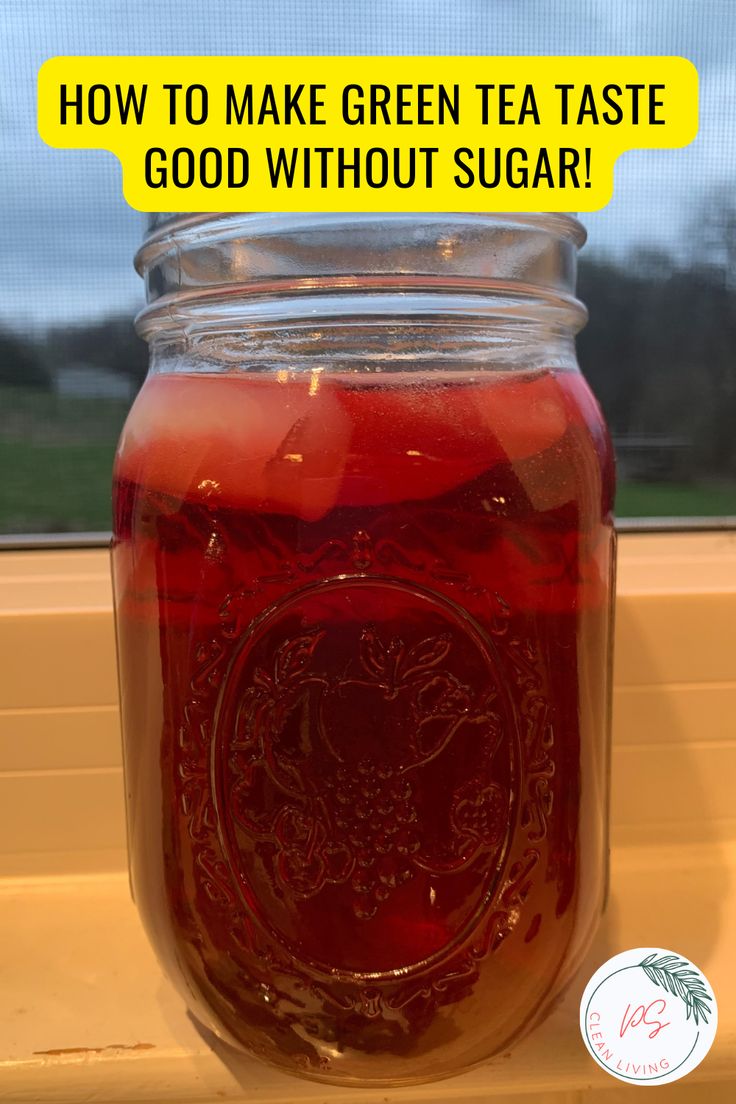 a jar filled with liquid sitting on top of a window sill