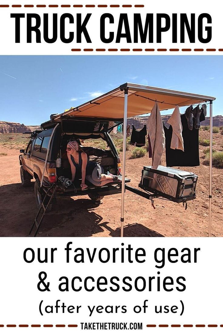 a woman sitting in the back of a van under a tent