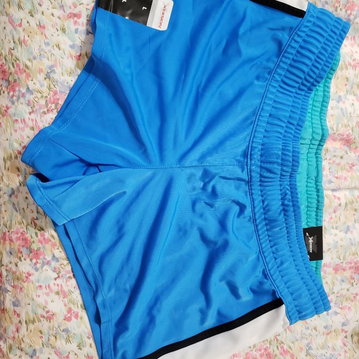 Xersion Gym Shorts, Can Have Tights And Layer On Top Blue Stretch Athletic Shorts, Sporty Blue Training Bottoms, Blue Stretch Athletic Shorts With Moisture-wicking, Blue Stretch Moisture-wicking Athletic Shorts, Blue Sporty Stretch Bottoms, Blue Sporty Athletic Shorts For Workout, Blue Sporty Workout Bottoms, Sporty Moisture-wicking Blue Bottoms, Sporty Blue Moisture-wicking Bottoms