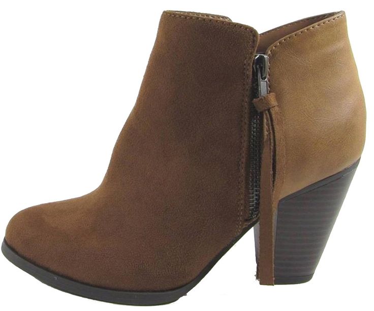 a pair of brown boots with zippers on the side and heeled soles