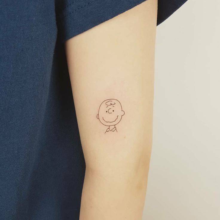 a person with a small tattoo on their arm