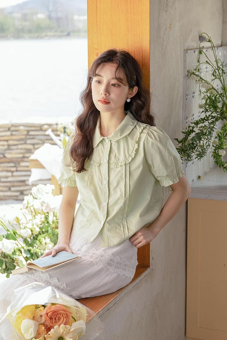 Button up shirt with short puff sleeves and ruffle details. S: 40" chest, 20" lengthM: 41.5" chest, 20" lengthL: 43" chest, 20.5" length Summer Short Sleeve Puff Top, Short Sleeve Puff Top For Summer Daywear, Summer Puff Sleeve Top With Short Sleeves For Daywear, Summer Puff Sleeve Top For Daywear, Daywear Short Sleeve Blouse With Ruffles, Short Sleeve Ruffled Blouse For Daywear, Casual Short Sleeve Ruffled Blouse, Casual Short Sleeve Blouse With Ruffles, Feminine Solid Color Puff Sleeve Top