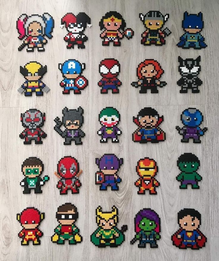 the avengers and captain america pixel art is displayed on a wooden surface with white wood flooring