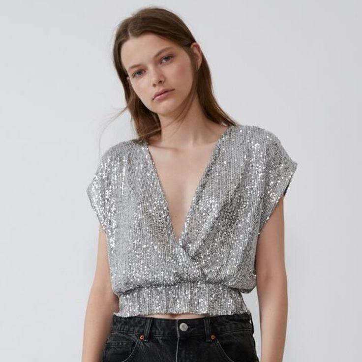 Nwt Zara Size S Gray Sequin Top Brand New With Tags Sleeveless Wrap-Front Top With Deep V-Neck. Elastic Waist. - 96% Polyester, 4% Elastane - Approximate Measurements: 20el" Armpit To Armpit, 19.5" Length V-neck Shimmer Tops For Party Season, Glamorous Summer V-neck Crop Top, Chic Metallic V-neck Top, Zara V-neck Party Blouse, Metallic V-neck Top For Summer, Glamorous Silver Sleeveless Tops, Chic Silver Sleeveless Top, Shimmer V-neck Top For Evening, Evening Shimmer V-neck Top