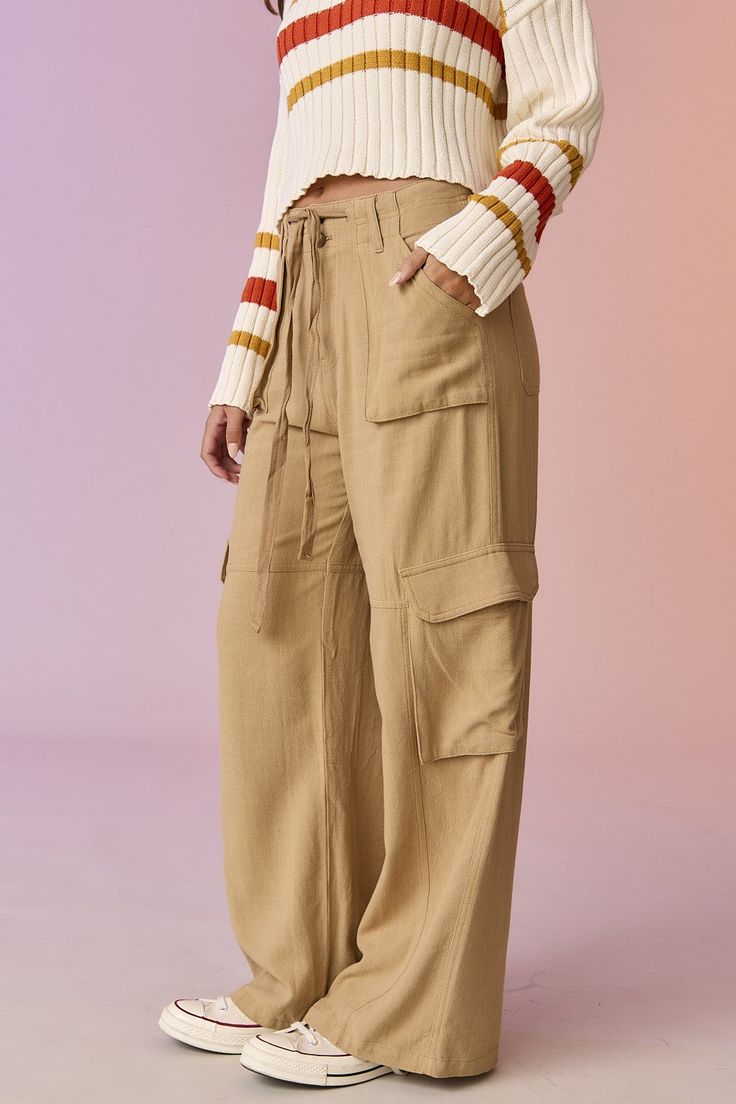 - wide leg utility cargos - slant pockets - cargo flap pockets - drawsring for adjustability WAIST 13 1/2 LENGTH 41 1/4 LEG OPENING 12 Model's height is 5' 7" and wearing a size S Gifts For Teen Boys, Stylish Women Fashion, Rose Boutique, Fall Essentials, Pants Large, Gift Accessories, Linen Pants, Womens Fashion Casual, Flap Pocket