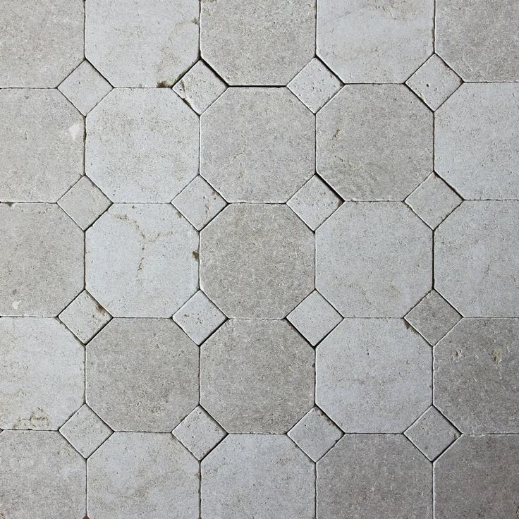 an image of a tile floor that looks like hexagonals or hexagon tiles