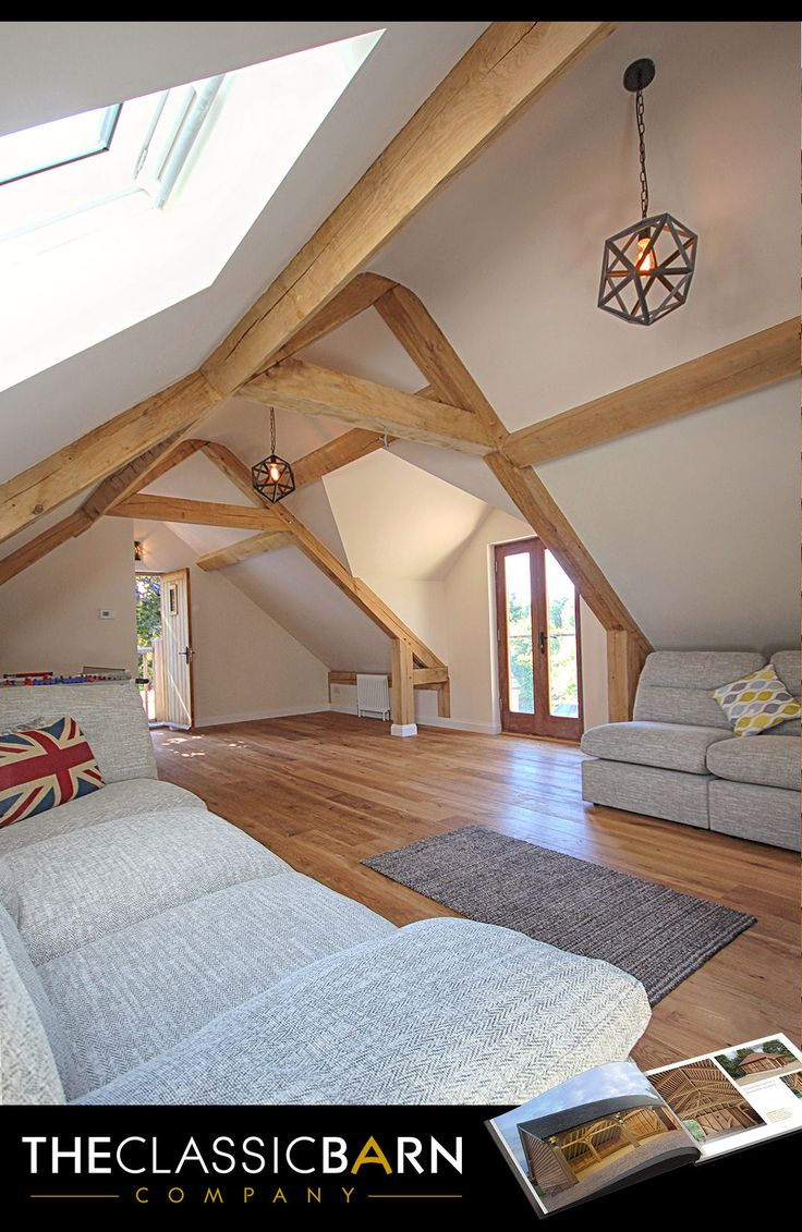 a living room filled with furniture under a skylight