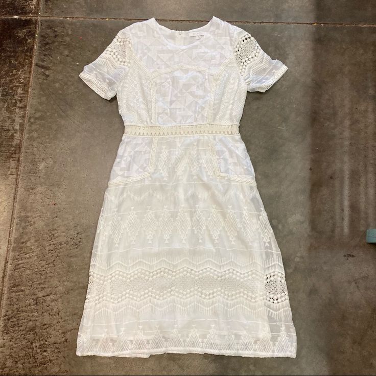 Anthropologie White Crochet And Embroidered Detail Dress. Fully Lined, Zip Back. Brand New Without Tags. White Embroidered Dress For Day Out, White Embroidered Lace Dress With Short Sleeves, White Midi Lace Dress With Floral Embroidery, White Lace Midi Dress With Floral Embroidery, White Knee-length Lace Dress With Floral Embroidery, Chic White Embroidered Midi Dress, White Short Sleeve Lace Dress For Daywear, White Lace Midi Dress For Daywear, White Embroidered Midi Dress With Short Sleeves