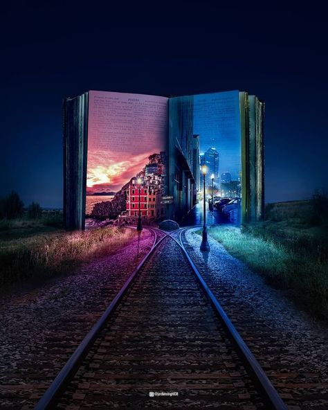 an open book sitting on top of train tracks in the middle of a field at night