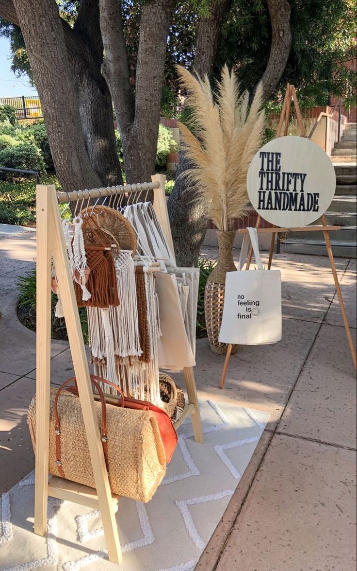 an assortment of handbags and purses are on display at the thrift handmade store