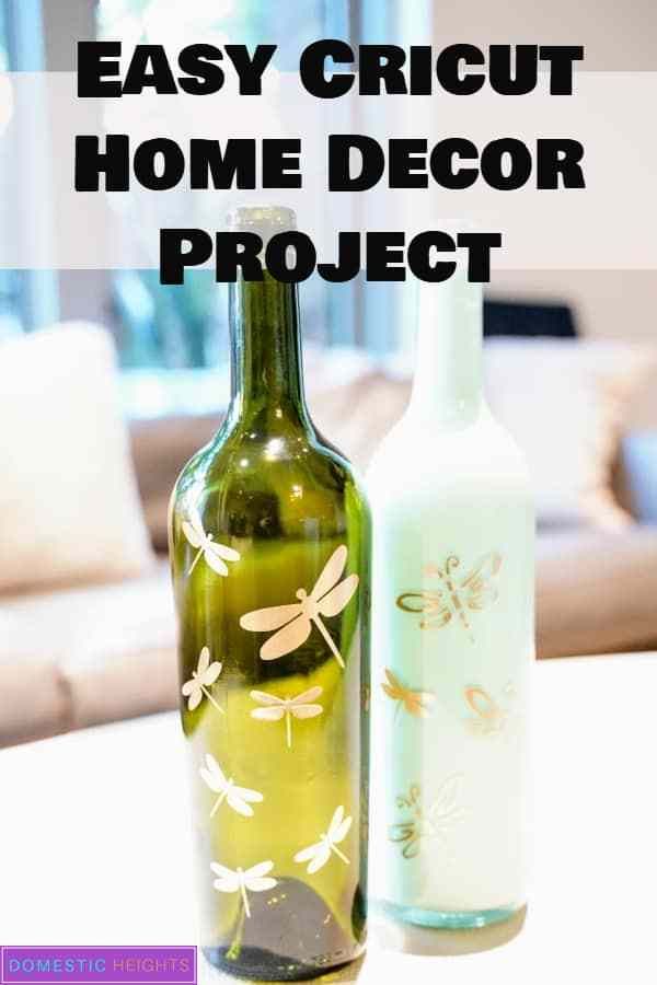 two wine bottles sitting on top of a table with the words easy cricut home decor project