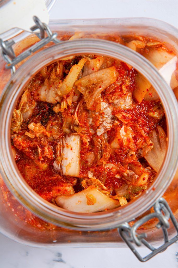 a jar filled with food sitting on top of a table