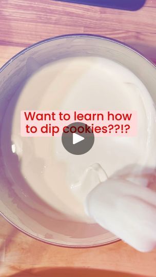 a bowl filled with yogurt sitting on top of a wooden table