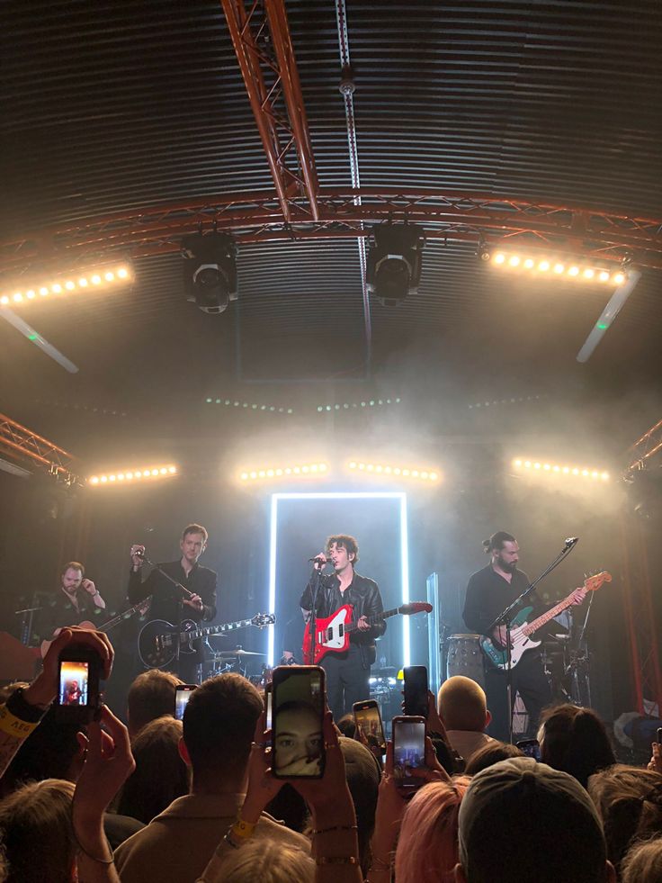 a group of people standing on top of a stage