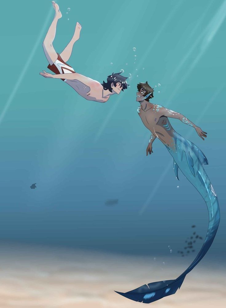 two people are swimming in the ocean with one holding on to his tail and the other looking at him