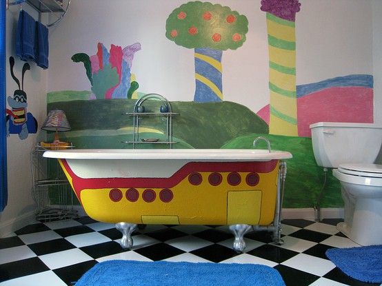 a bathroom with a bathtub, toilet and rugs