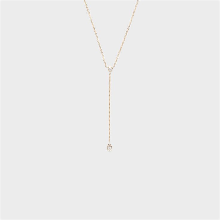 This dainty and sophisticated piece is the perfect addition to any collection! 14k Gold Lariat Diamond Necklace Gift, Minimalist Long Drop Diamond Jewelry, Elegant 14k Gold Diamond Necklace With Teardrop Pendant, Delicate White Gold Lariat Necklace With Adjustable Chain, Dainty White Gold Lariat Necklace With Delicate Chain, Minimalist White Gold Lariat Necklace With Delicate Chain, 14k Gold Drop Necklace Fine Jewelry, 14k White Gold Lariat Necklace With Adjustable Chain, Elegant 14k Gold Lariat Diamond Necklace