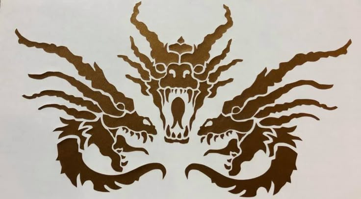 an image of a dragon tattoo design on a white paper sheet that is cut out to look like it's coming out of the water