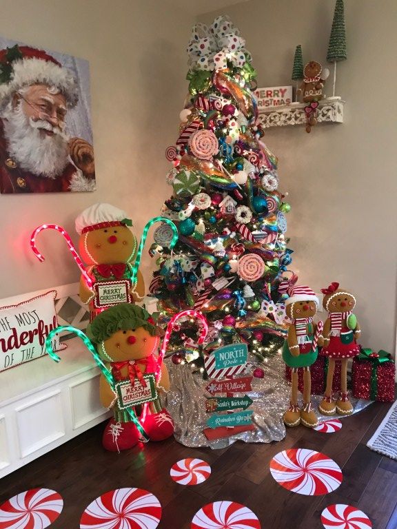 a christmas tree decorated with candy canes and candies