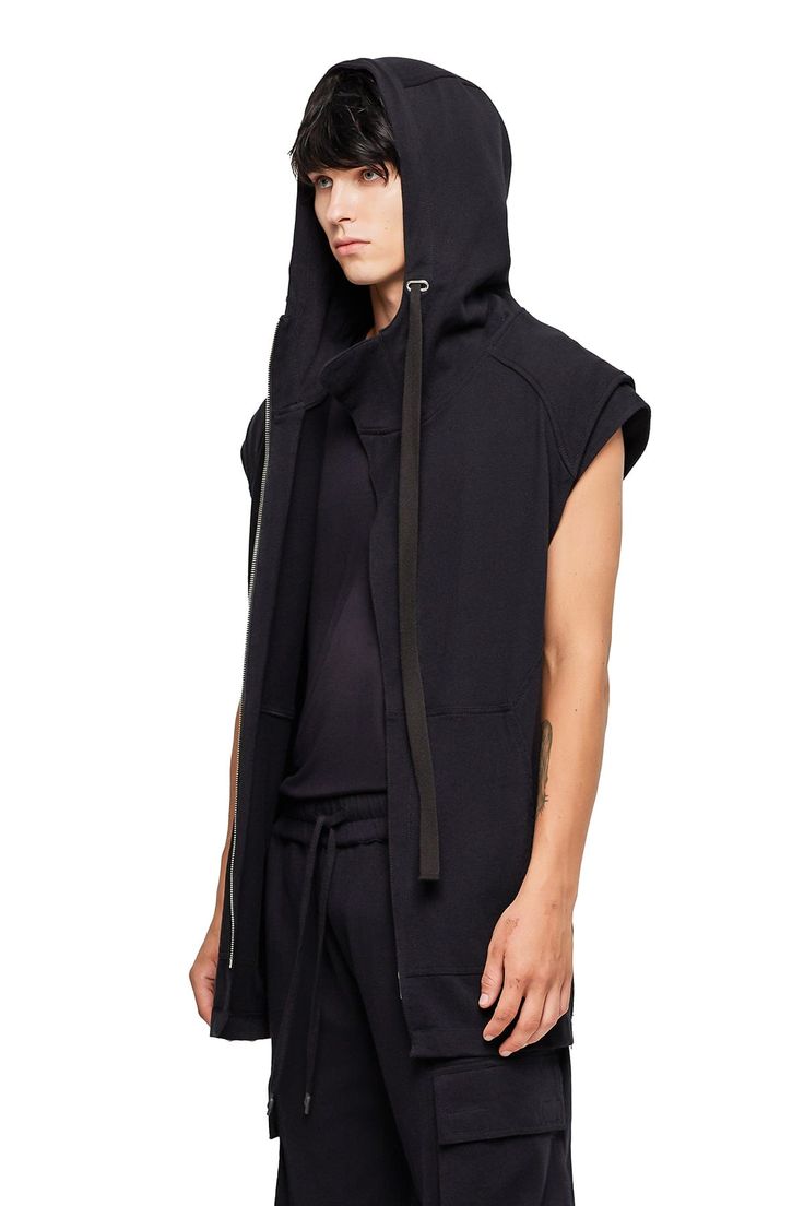 Luxe and insanely soft, our Sleeveless Long Hoodie has a tailored, athletic fit with defined ribbing at the hem and armor shoulder detail. — Cotton spandex rib hem— Oversized hood— 100% heavy jersey cotton SIZE + FIT— Athletic sweatshirt fit— Longline hem— Fits true to size— Model is 6'1 and is wearing a size L CARE— Hand wash cold, lay flat to dry Washed Black Hooded Hoodie With Pockets, Oversized Black Hoodie With Side Pockets, Washed Black Hoodie With Adjustable Hood For Streetwear, Mens Sleeveless Hoodie, Washed Black Hooded Hoodie With Soft-wash, Athletic Sweatshirts, Hooded Vest, Sleeveless Hoodie, Athletic Fits