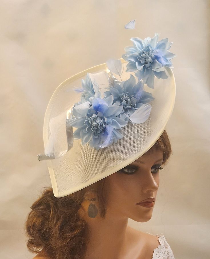 Large White and  Blue hat. Georgeous  Hat Fascinator with long Swril. Beautiful Gorgeous Teardrop Blue sinamay Hat fascinator with long Swril with featherd Light Blue Silk flower details. Hat base longest part is almost 30cm . perfect for Royal Ascot, Kentucky Derby, Weddings, Goodwood revival, Christening, Ascot, Mother of Bride /Groom or any special occasion. Gorgeous  Gorgeous Blue Teardrop Sinamay  Hat fascinator with long Swril, featherd Light Blue Silk flower details.  For Same fascinator with blue hat base please click the link below as last picture https://www.etsy.com/uk/listing/1678350299/blue-fascinator-hat-large-saucer **Do you like to have this in any other custom colours mix with digfferent flowers or base, Please message. if possible with the dress picture* This hat has been Blue Fascinator, Sinamay Hats, Hat Fascinator, Goodwood Revival, Hat Base, Fascinator Hat, Alice Band, Light Blue Dresses, Mother Of Bride