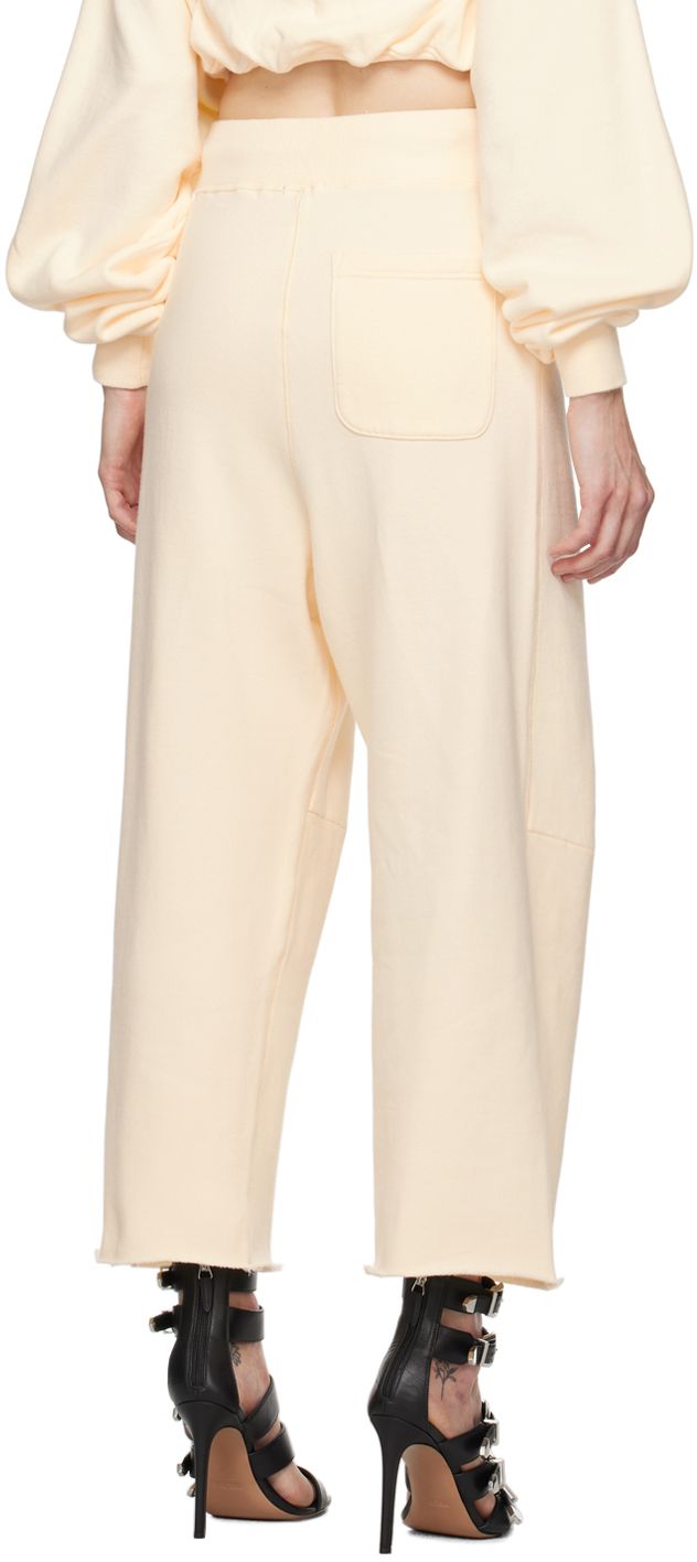 Wide-leg cotton fleece sweatpants. · Drawstring at elasticized waistband · Three-pocket styling · Pleats at front · Darts at knees · Raw edge at cropped cuffs Supplier color: Natural Spring Sweatpants With Ribbed Cuffs And Tapered Leg, Relaxed Fit Sweatpants With Hip Pockets For Spring, Spring Sweatpants With Hip Pockets And Relaxed Fit, Spring Relaxed Fit Sweatpants With Hip Pockets, Wide Leg Sweatpants With Hip Pockets For Spring, Spring Bottoms With Ribbed Cuffs And Tapered Leg, Spring Streetwear Bottoms With Ribbed Cuffs, Wide-leg Sweatpants With Elastic Cuffs For Spring, Athleisure Sweats With Pockets For Spring